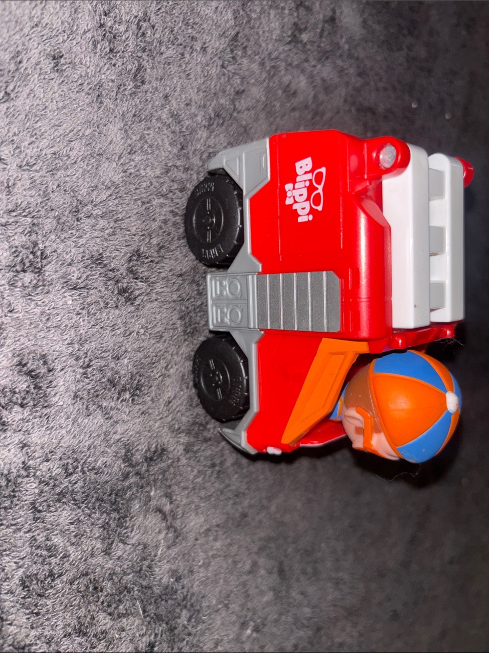 Blippi-Red Toy Fire Truck with Orange-Blue Figure